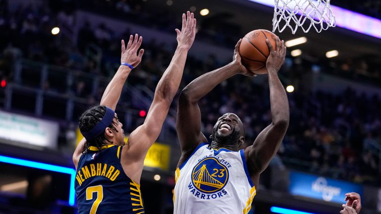 Draymond Green shoots over Indiana Pacers guard Andrew Nembhard.