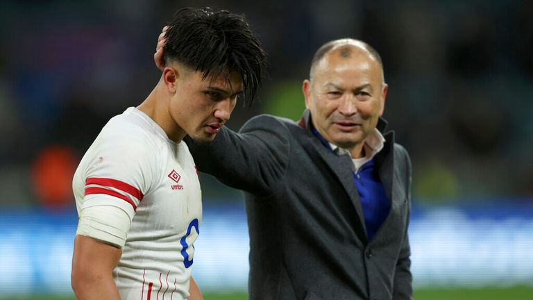 England's Marcus Smith walks with England's head coach Eddie Jones at the end of the international rugby union match between England and New Zealand at Twickenham stadium in London, Saturday, Nov. 19, 2022. The match ended in a 25-25 draw. (AP Photo/Ian Walton)