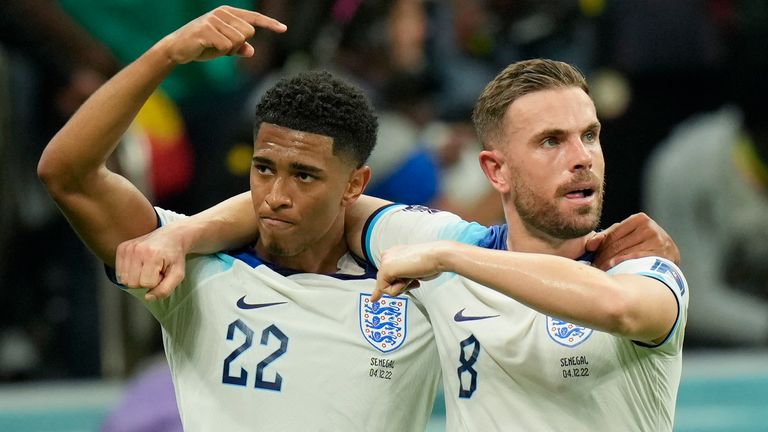 Jordan Henderson and Jude Bellingham celebrate England's opening goal against Senegal