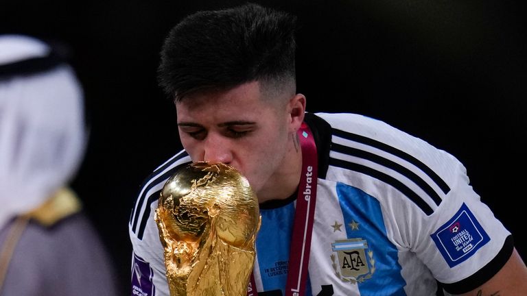 Argentina&#39;s Enzo Fernandez kisses the trophy after winning the World Cup final soccer match between Argentina and France at the Lusail Stadium in Lusail, Qatar, Sunday, Dec.18, 2022. (AP Photo/Manu Fernandez)