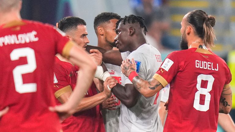 Serbia&#39;s Filip Kostic and Switzerland&#39;s Breel Embolo exchange words as the game becomes heated in the second half