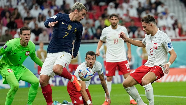 Antoine Griezmann flicks the ball back across the face of Poland&#39;s goal