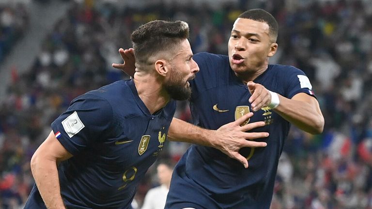 Goalscorers Olivier Giroud and Kylian Mbappe celebrate during France's World Cup clash with Poland