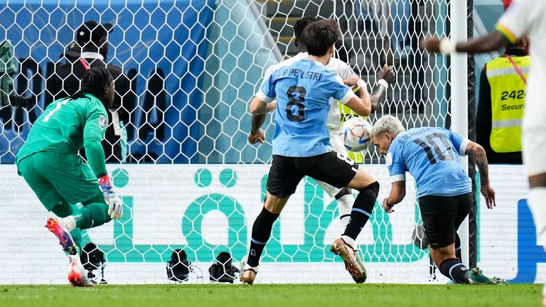 Uruguay's Giorgian de Arrascaeta scores the opening goal of the game