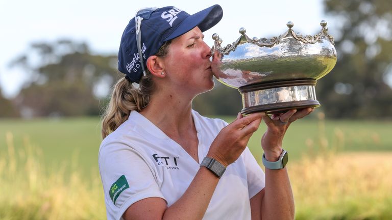 South Africa&#39;s Ashleigh Buhai kisses the Australian Open golf championship trophy for the women&#39;s title at Victoria golf course in Melbourne, Australia, Sunday, Dec. 4, 2022.