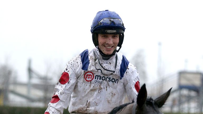Harry Cobden is all smiles as he returns to the winner's enclosure at Newbury