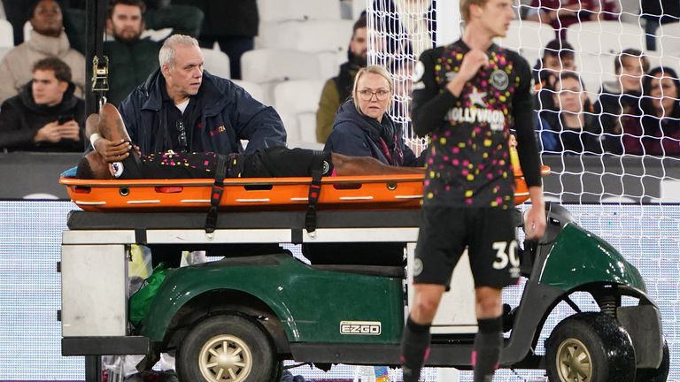 Toney is carried off on a stretcher in the closing stages