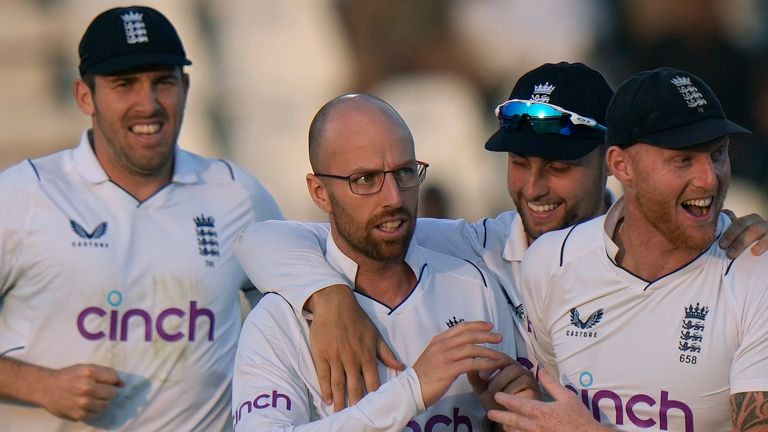 England&#39;s Jack Leach, center, celebrates with teammates after taking the wicket of Pakistan&#39;s Imam-ul-Haq during the third day of the second test cricket match between Pakistan and England, in Multan, Pakistan, Sunday, Dec. 11, 2022. (AP Photo/Anjum Naveed) 