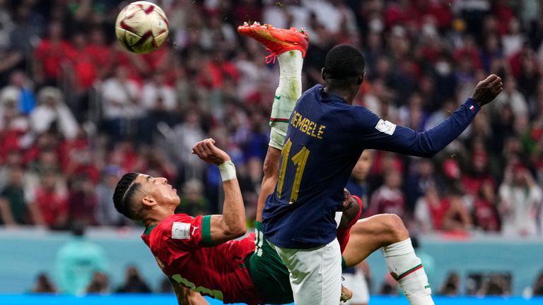 Morocco's Jawad El Yamiq attempts an overhead kick thats hits the post