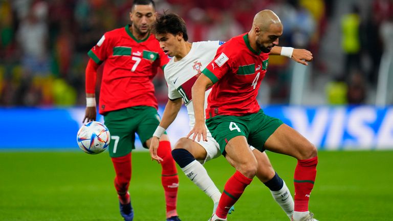 Joao Felix is challenged by Sofyan Amrabat and Hakim Ziyech