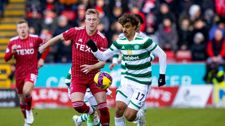 ABERDEEN, SCOTLAND - DECEMBER 17: Jota and Ross McCrorie in action during a cinch Premiership match between Aberdeen and Celtic  at Pittodrie, on December 17, 2022, in Aberdeen, Scotland.  (Photo by Alan Harvey / SNS Group)