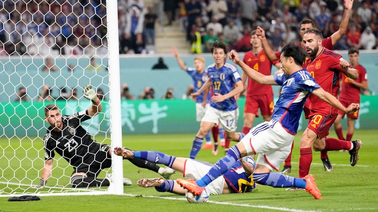 Kaoru Mitoma passes to team-mate Ao Tanaka who scores Japan's second goal against Spain