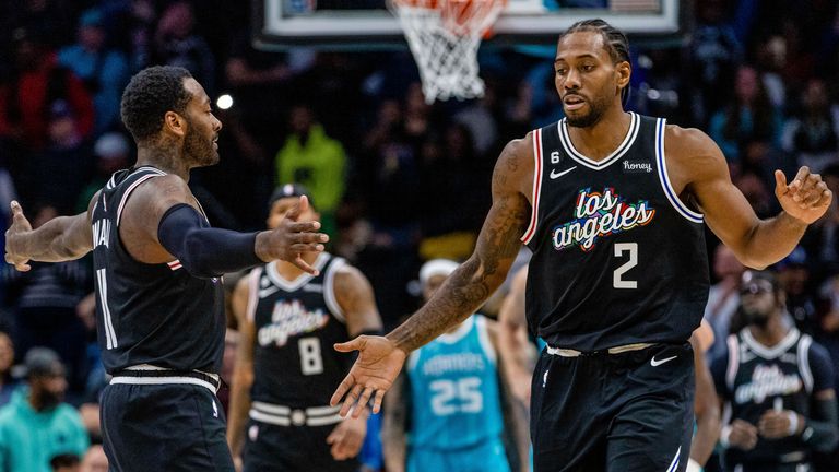 LA Clippers guard John Wall and forward Kawhi Leonard (2) celebrate after taking the lead against the Charlotte Hornets