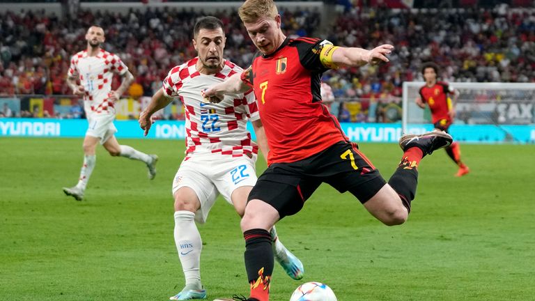 Belgium's Kevin De Bruyne and Croatia's Josip Juranovic in action