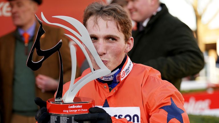 Harry Cobden plants a kiss on the King George trophy after victory on Bravemansgame