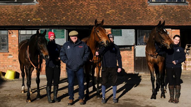 Paul Nicholls poses with his three King George contenders Frodon, Bravemansgame and Hitman. Credit: The Jockey Club/John Hoy 