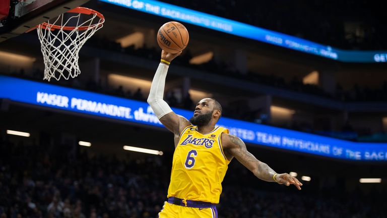 Los Angeles Lakers forward LeBron James scores a basket against the Sacramento Kings during the second half of an NBA basketball game in Sacramento, Calif., Wednesday, Dec. 21, 2022. The Kings won 134-120. (AP Photo/José Luis Villegas)