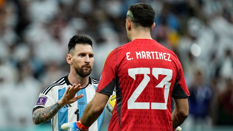 Argentina&#39;s Lionel Messi celebrates with Argentina&#39;s goalkeeper Emiliano Martinez at the end of the World Cup quarterfinal soccer match between the Netherlands and Argentina, at the Lusail Stadium in Lusail, Qatar, Saturday, Dec. 10, 2022. Argentina defeated the Netherlands 4-3 in a penalty shootout after the match ended tied 2-2.(AP Photo/Jorge Saenz)