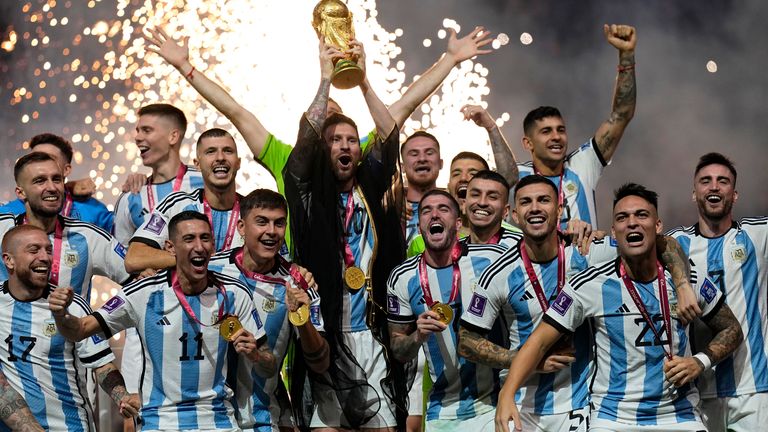 Argentina&#39;s Lionel Messi lifts the trophy after winning the World Cup final soccer match between Argentina and France at the Lusail Stadium in Lusail, Qatar, Sunday, Dec. 18, 2022. Argentina won 4-2 in a penalty shootout after the match ended tied 3-3. (AP Photo/Martin Meissner)