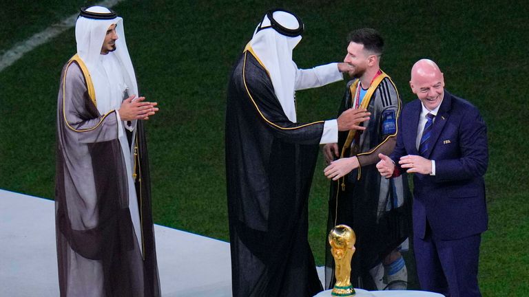 Lionel Messi had a Qatari robe put on him before lifting the World Cup trophy