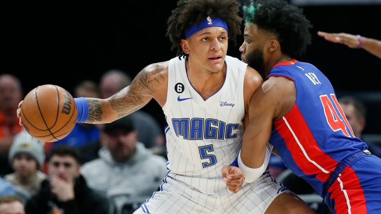 Orlando Magic forward Paolo Banchero (5) drives against Detroit Pistons forward Saddiq Bey (41) during the first half of an NBA basketball game Wednesday, Dec. 28, 2022, in Detroit.