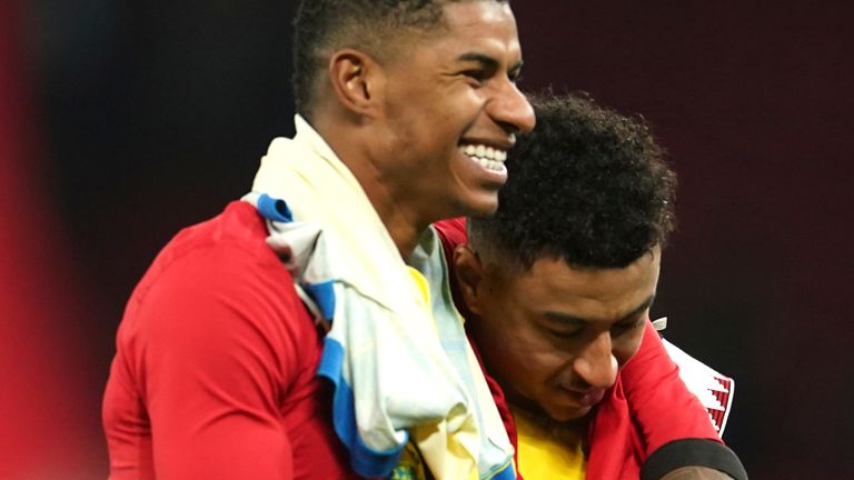 Nottingham Forest's Jesse Lingard, right, and Manchester United's Marcus Rashford leave the pitch after the English Premier League soccer match between Manchester United and Nottingham Forest at Old Trafford in Manchester, England, Tuesday, Dec. 27, 2022. (AP Photo/Dave Thompson)