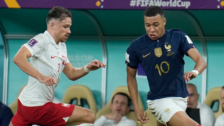 France's Kylian Mbappe, right, and Poland's Matty Cash