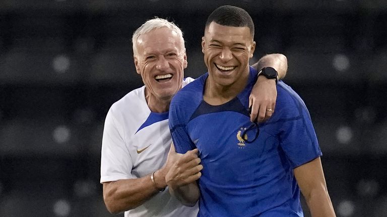 France&#39;s head coach Didier Deschamps, and Kylian Mbappe arrive for a training session at the Jassim Bin Hamad stadium in Doha, Qatar, Tuesday, Nov. 29, 2022 on the eve of the group D World Cup soccer match between Tunisia and France. (AP Photo/Christophe Ena)