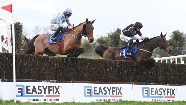 Minella Crooner and Jack Kennedy (left) win the Jim Ryan Racecourse Services Beginners Chase from I Am Maximus (right)