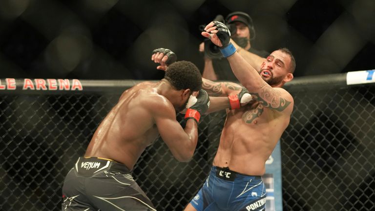 Santiago Ponzinnibio takes a jab to the face in a light heavyweight clash in UFC 280.