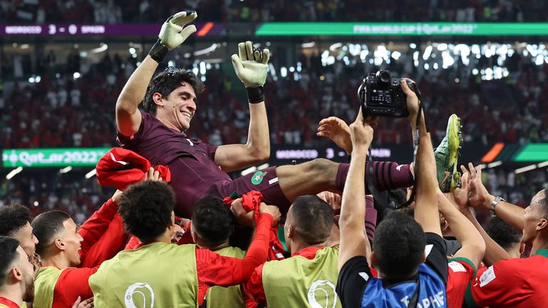 Morocco goalkeeper Yassine Bounou is chaired off the field by his team-mates