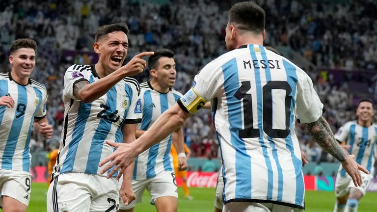 Argentina&#39;s Nahuel Molina, center, celebrates with Lionel Messi, right, after scoring the opening goal during the World Cup quarterfinal soccer match between the Netherlands and Argentina, at the Lusail Stadium in Lusail, Qatar, Friday, Dec. 9, 2022. (AP Photo/Ricardo Mazalan)