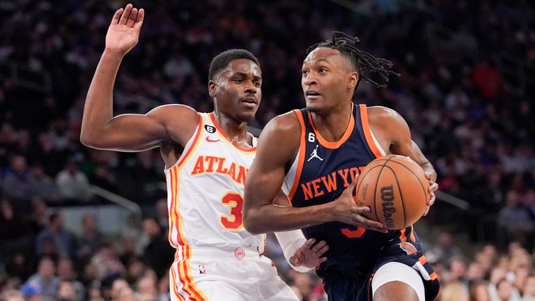 New York Knicks guard Immanuel Quickley (5) drives against Atlanta Hawks guard Aaron Holiday (3) during the second half of an NBA basketball game Wednesday, Dec. 7, 2022, at Madison Square Garden in New York. (AP Photo/Mary Altaffer)


