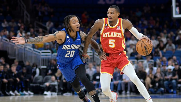 Atlanta Hawks guard Dejounte Murray (5) is defended by Orlando Magic guard Markelle Fultz (20) during the first half of an NBA basketball game Wednesday, Nov. 30, 2022, in Orlando, Fla