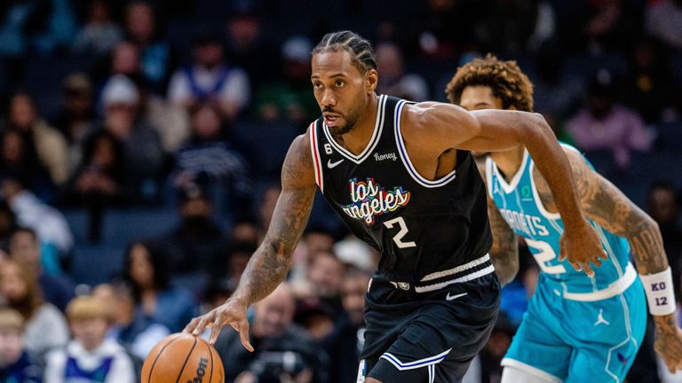 LA Clippers forward Kawhi Leonard (2) brings the ball up court for a quick break in the first half of an NBA basketball game against the Charlotte Hornets on Monday, Dec.  5, 2022, in Charlotte, NC (AP Photo/Scott Kinser)