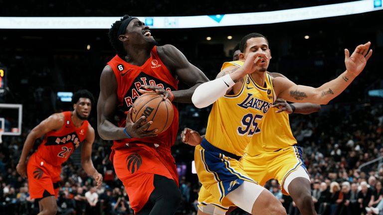 Toronto Raptors&#39; Pascal Siakam drives at Los Angeles Lakers&#39; Juan Toscano-Anderson during the second half of an NBA basketball game in Toronto on Wednesday, Dec. 7, 2022. (Chris Young/The Canadian Press via AP)


