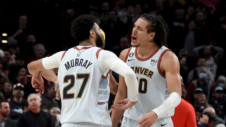 Denver Nuggets guard Jamal Murray, left, celebrates with forward Aaron Gordon after hitting a 3-pointer with less than a second to play in the team&#39;s NBA basketball game against the Portland Trail Blazers in Portland, Ore., Thursday, Dec. 8, 2022. The Nuggets won 121-120. 