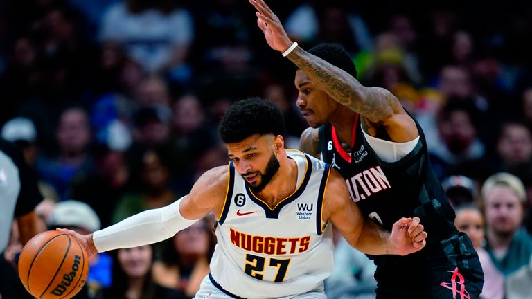 Denver Nuggets guard Jamal Murray (27) is pressured by Houston Rockets guard Kevin Porter Jr. (3) during the second quarter of an NBA basketball game Wednesday, Nov. 30, 2022, in Denver