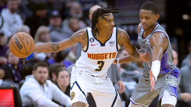 Denver Nuggets guard Bones Hyland (3) is guarded by Sacramento Kings guard De&#39;Aaron Fox during the second half of an NBA basketball game in Sacramento, Calif., Wednesday, Dec. 28, 2022. The Kings won 127-126.