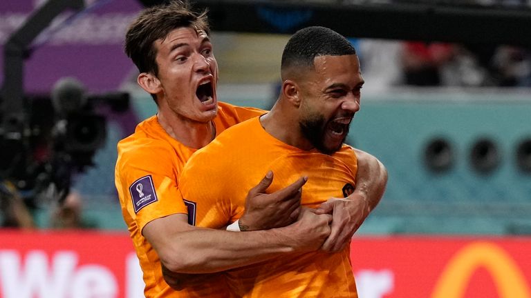 Memphis Depay celebrates with a team-mate after scoring the opening goal against USA