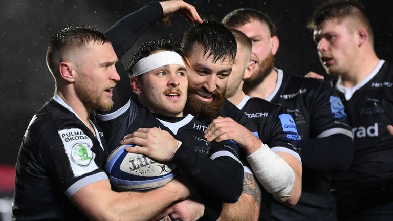 Newcastle wing Mateo Carreras celebrates with team-mates after scoring the first try