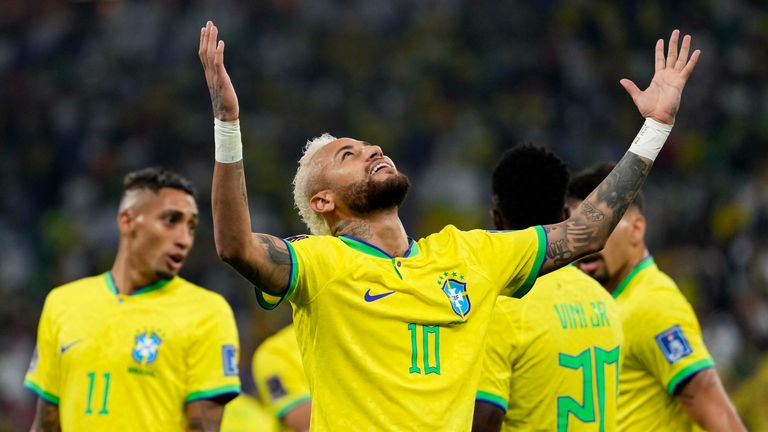 Neymar celebrates after scoring his penalty