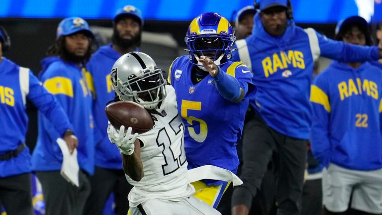 Las Vegas Raiders wide receiver Davante Adams (17) makes a one-handed catch as Los Angeles Rams cornerback Jalen Ramsey defends during the first half of an NFL football game Thursday, Dec. 8, 2022, in Inglewood, Calif.
