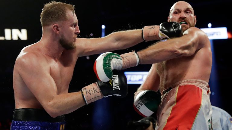 Otto Wallin, of Sweden, punches Tyson Fury, of England, during their heavyweight boxing match Saturday, Sept. 14, 2019, in Las Vegas. (AP Photo/Isaac Brekken)