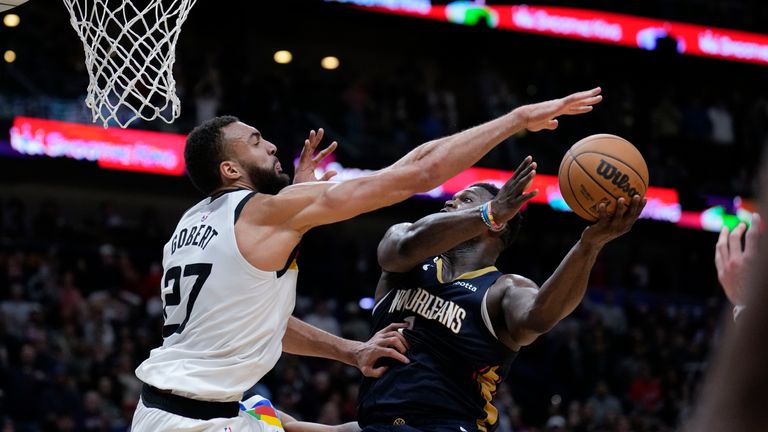 New Orleans Pelicans forward Zion Williamson (1) goes to the basket against Minnesota Timberwolves center Rudy Gobert (27) in the second half of an NBA basketball game in New Orleans, Wednesday, Dec. 28, 2022. The Pelicans won 119-118. 