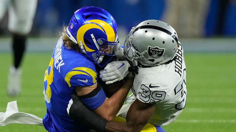 Los Angeles Rams wide receiver Ben Skowronek, left, holds on to a reception as he is hauled down by Las Vegas Raiders cornerback Nate Hobbs during the second half of an NFL football game Thursday, Dec. 8, 2022, in Inglewood, Calif.