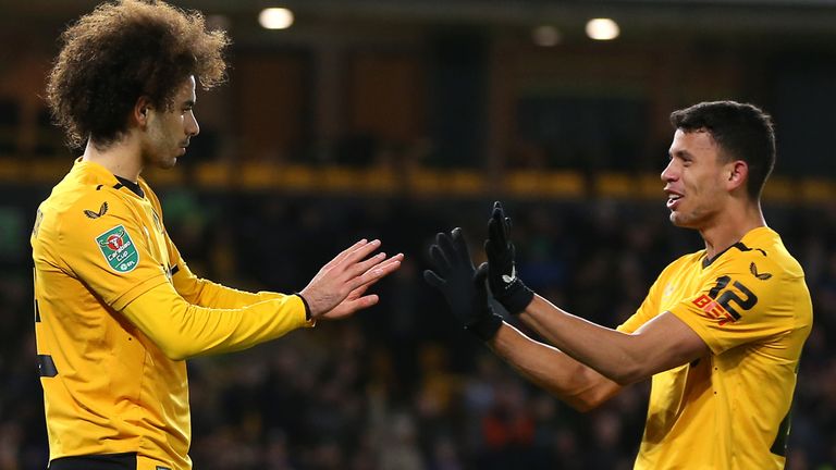 Wolverhampton Wanderers' Rayan Ait-Nouri (left) celebrates scoring their side's second goal of the game with team-mate Matheus Nunes during the Carabao Cup fourth round match at Molineux Stadium, Wolverhampton. Picture date: Tuesday December 20, 2022.