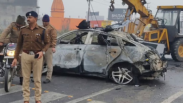 Policemen investigate the scene of a car accident near Roorkee, in the northern Indian state of Uttarakhand, Friday, Dec. 30, 2022. Indian cricketer Rishabh Pant, 25, was driving the car that overturned and caught fire after hitting a road divider, Ravi Bijaria, a state government spokesman said. Pant, who was alone at the time of the accident, was hospitalized on Friday with non life-threatening injuries. (AP Photo)