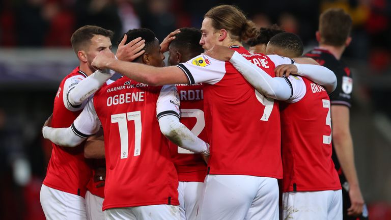 Rotherham players celebrate after taking the lead through a Stoke City own goal