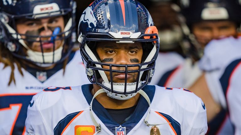 Denver Broncos quarterback Russell Wilson (3) prepares to run onto the field at the start of an NFL football game between the Carolina Panthers and the Denver Broncos on Sunday, Nov. 27, 2022, in Charlotte, N.C. (AP Photo/Jacob Kupferman)